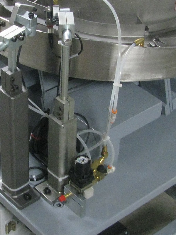 Track and tooling section of a vibratory bowl feeder used for throughput validation